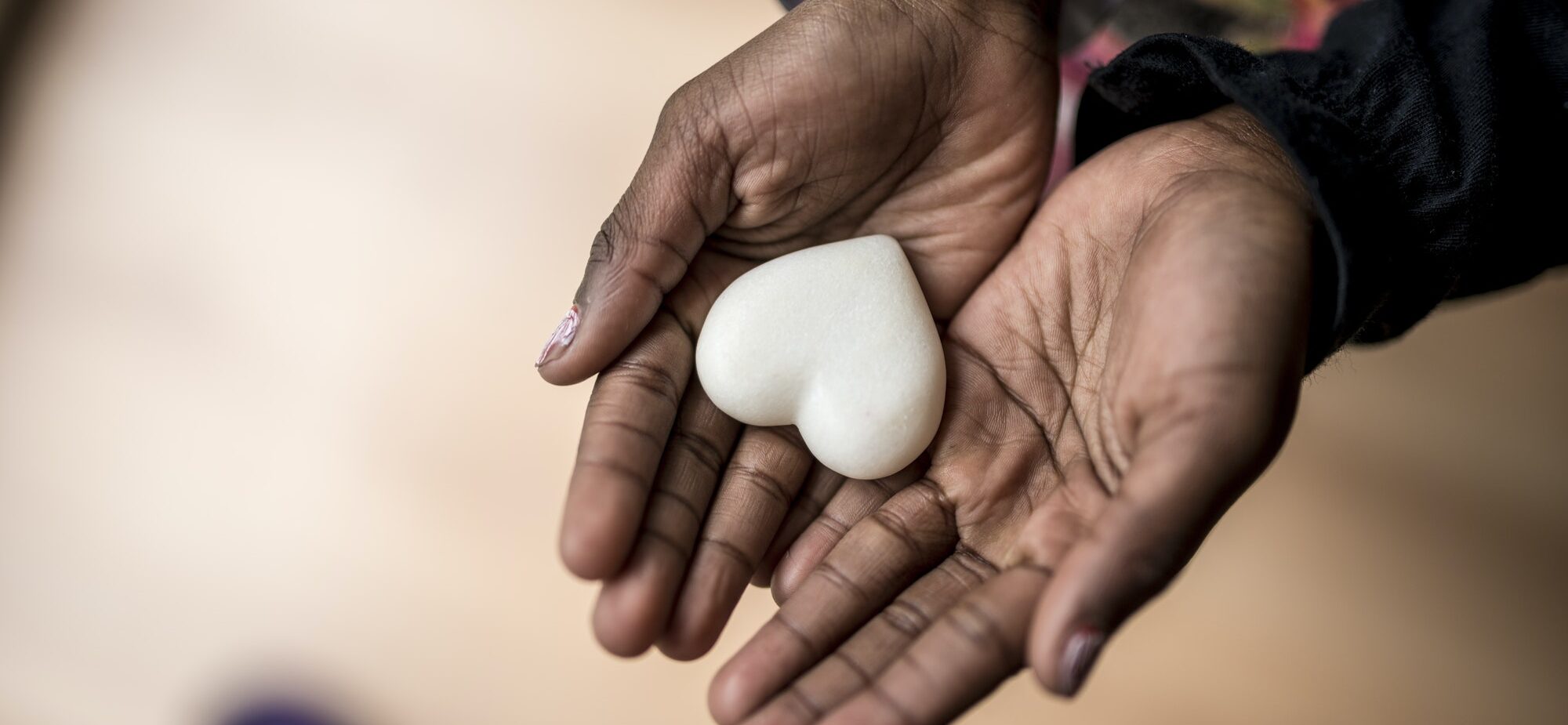 african-american-girl-hands-holding-a-marble-made-heart.jpg